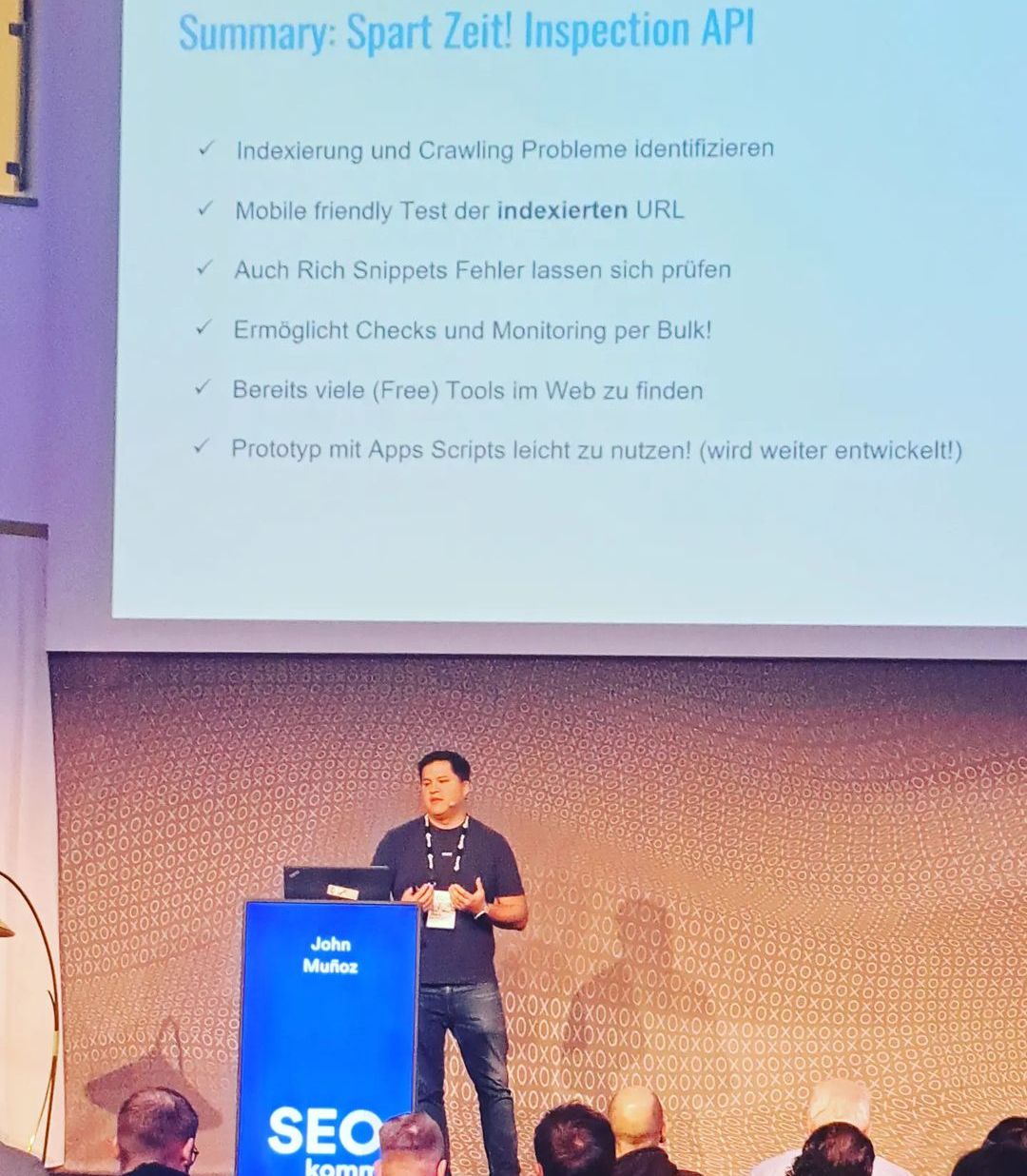 John speaking at an event